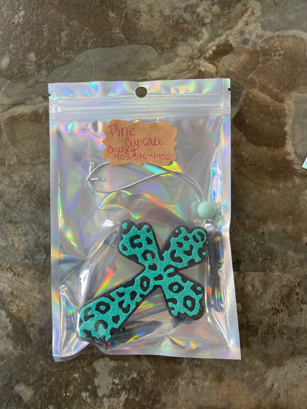 black and teal cross