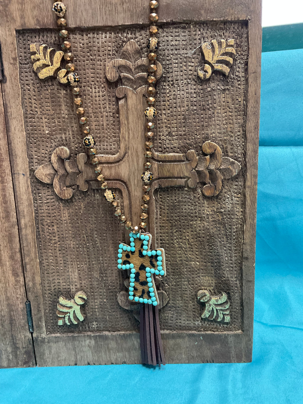 Dazzling bead necklace with cheetah cross
